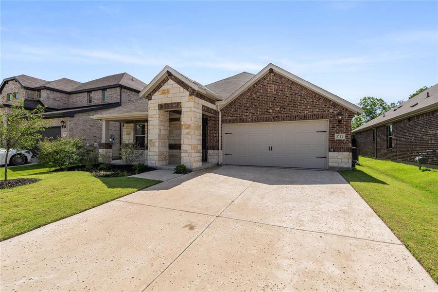 Front exterior of a new home in Lakehaven - Signature Series, Farmersville, TX, highlighting curb appeal (Image 2). Front exterior of a new home in Lakehaven - Signature Series, Farmersville, TX, highlighting curb appeal (Image 2).