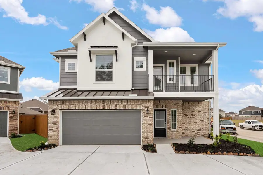 Front exterior of a new home in Elyson, Katy, TX, highlighting curb appeal (Image 1). Front exterior of a new home in Elyson, Katy, TX, highlighting curb appeal (Image 1).