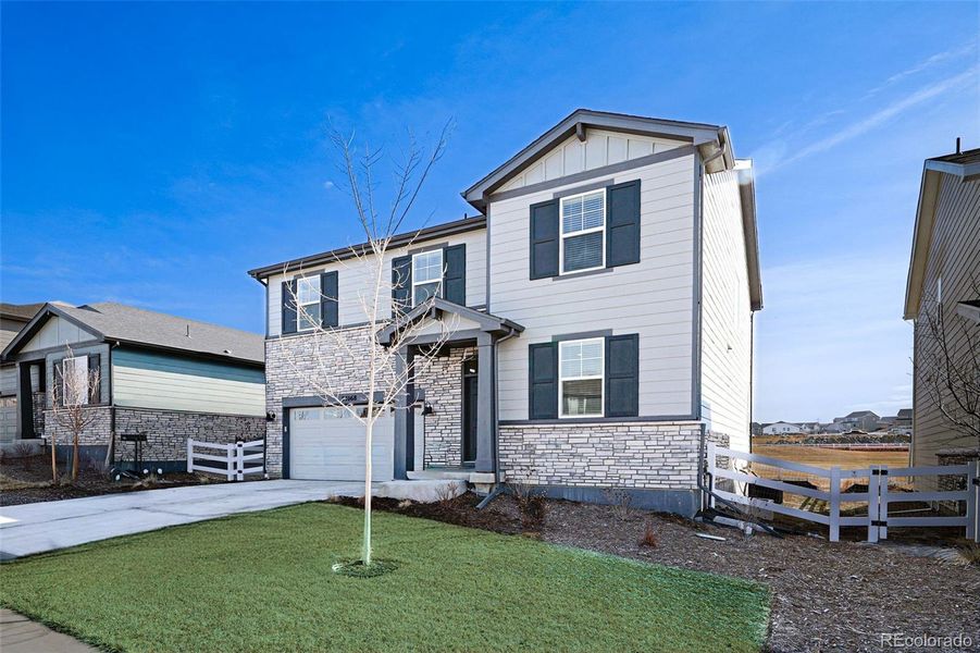 Front exterior of a new home in Murphy Creek, Aurora, CO, highlighting curb appeal (Image 24).