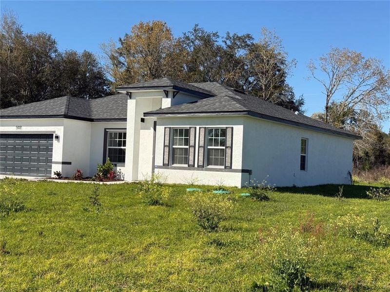 Front exterior of a new home in , Ocala, FL, highlighting curb appeal (Image 12).