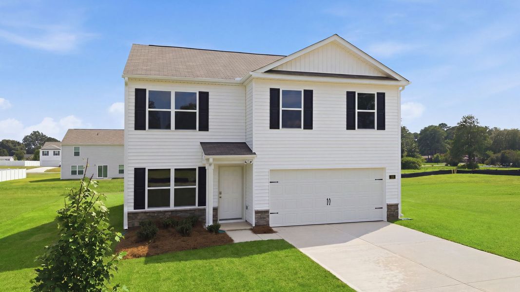 Front exterior of a new home in Blair Ridge, La Grange, NC, highlighting curb appeal (Image 2). Front exterior of a new home in Blair Ridge, La Grange, NC, highlighting curb appeal (Image 2).
