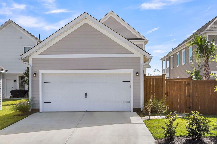 Front exterior of a new home in Midtown at Nexton, Summerville, SC, highlighting curb appeal (Image 1).