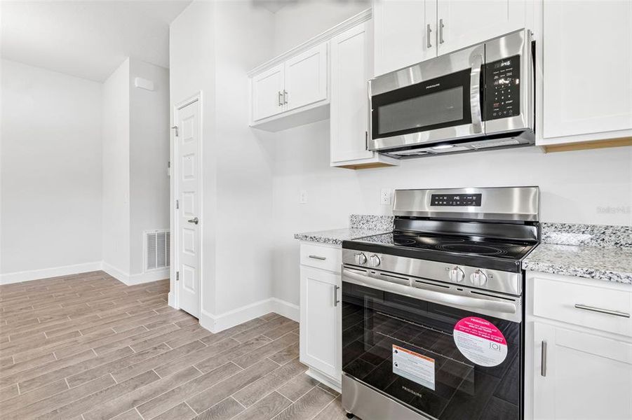 Furnished interior view inside a new home in Abbey Glen, Dade City (Image 9).