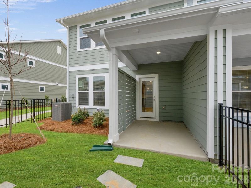 Exterior details and patio area of a home in North Creek Village, Huntersville (Image 3).
