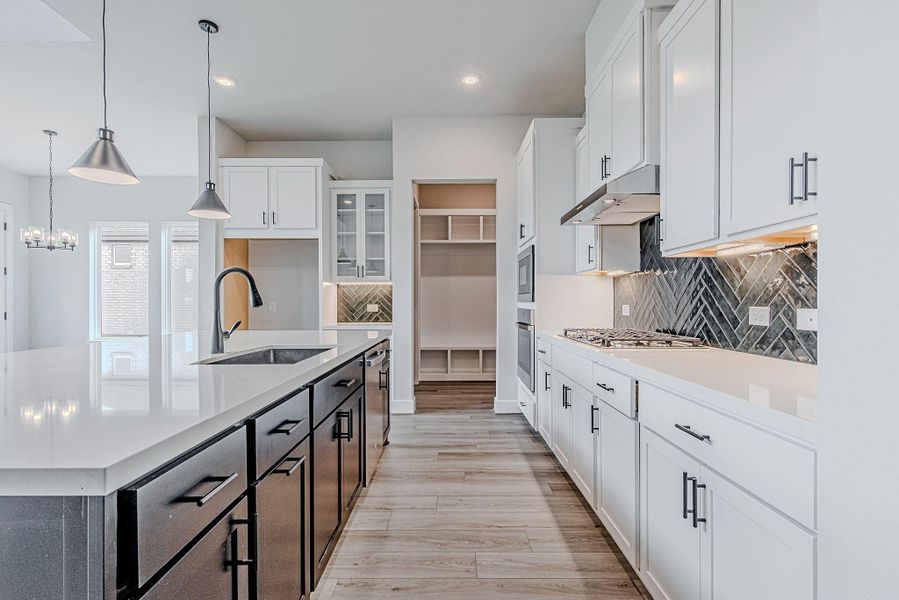 Modern kitchen featuring sleek cabinetry, stainless steel appliances, and a functional layout.