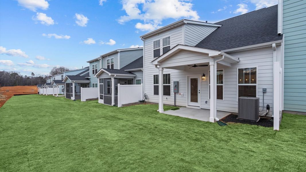 Superior curb appeal continues to the back with a refined, covered outdoor living space