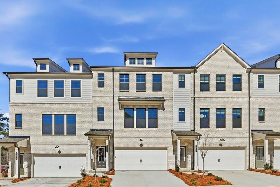 Front exterior of a new home in Rosewood Farm, Lawrenceville, GA, highlighting curb appeal (Image 2). Front exterior of a new home in Rosewood Farm, Lawrenceville, GA, highlighting curb appeal (Image 2).