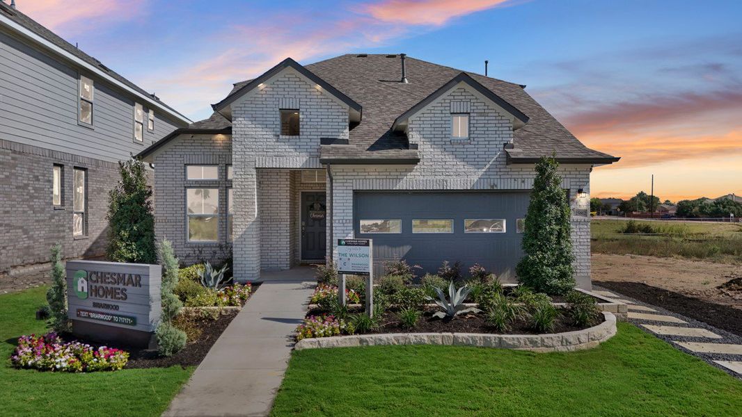 Front exterior of a new home in Briarwood, Elgin, TX, highlighting curb appeal (Image 24).