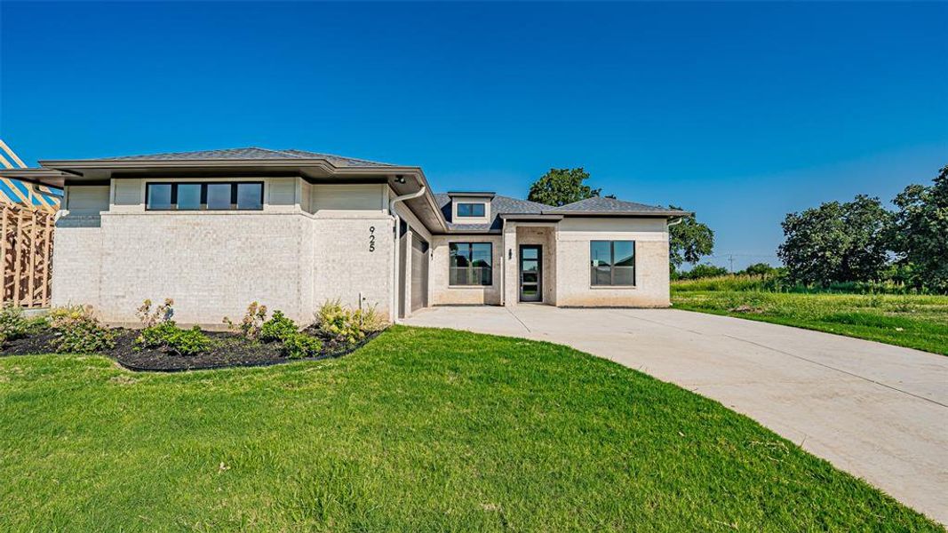 Front exterior of a new home in , Burleson, TX, highlighting curb appeal (Image 23).