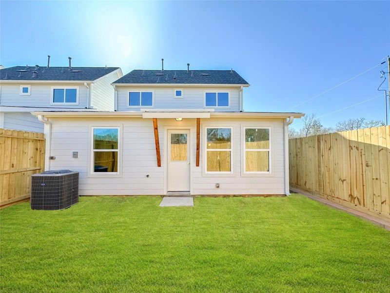 Exterior details and patio area of a home in , Conroe (Image 26).