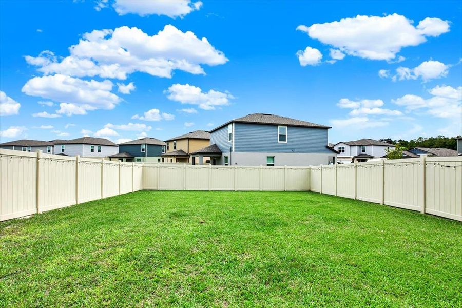 Front exterior of a new home in Two Rivers: The Manors II, Zephyrhills, FL, highlighting curb appeal (Image 23). Front exterior of a new home in Two Rivers: The Manors II, Zephyrhills, FL, highlighting curb appeal (Image 23).