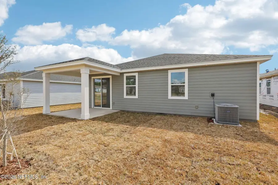 Exterior details and patio area of a home in Cypress Meadows - Signature Series, Jacksonville (Image 3).