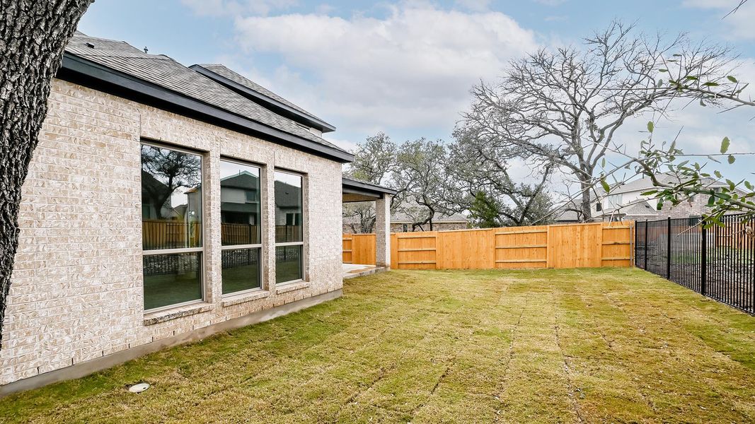 Exterior details and patio area of a home in 6 Creeks, Kyle (Image 24).
