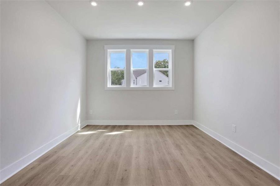 Spacious, unfurnished interior of a new home in The Paddocks at Doc Hughes, Buford (Image 15).