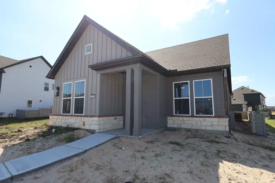Exterior details and patio area of a home in Pomona - Grove Row Collection, Manvel (Image 3).