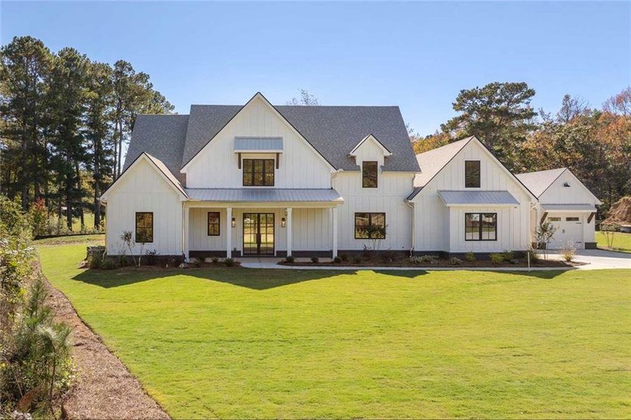 Front exterior of a new home in , Woodstock, GA, highlighting curb appeal (Image 30).