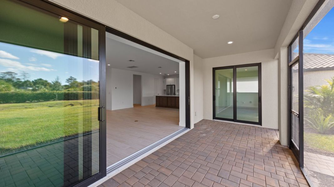 Exterior details and patio area of a home in SkySail, Naples (Image 23).
