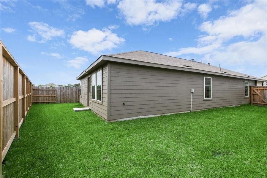 Exterior details and patio area of a home in Tavola, New Caney (Image 23).