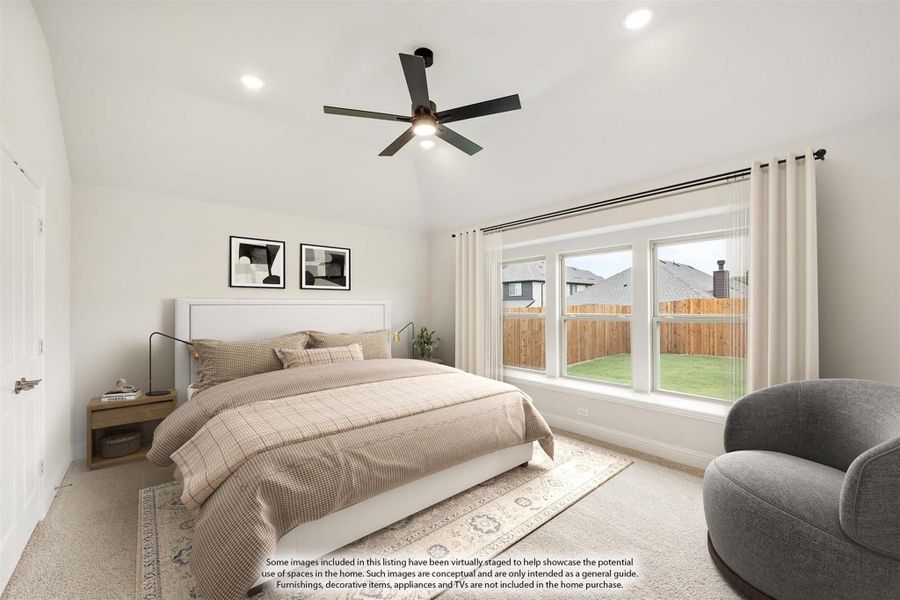 Bedroom with vaulted ceiling, ceiling fan, large windows, and carpet flooring
