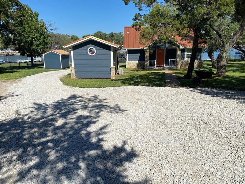 Front exterior of a new home in , Graford, TX, highlighting curb appeal (Image 2).