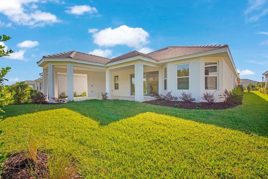 Exterior details and patio area of a home in Esplanade at Wiregrass Ranch, Wesley Chapel (Image 26).