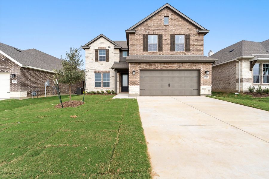 Front exterior of a new home in Liberty Pointe, Gainesville, TX, highlighting curb appeal (Image 22). Front exterior of a new home in Liberty Pointe, Gainesville, TX, highlighting curb appeal (Image 22).