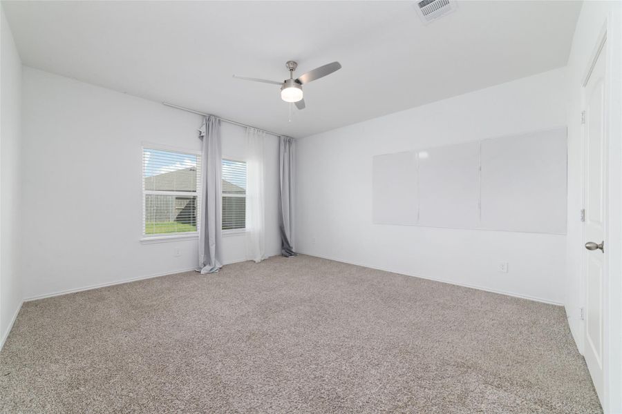 Spacious, unfurnished interior of a new home in Sunterra, Katy (Image 28).