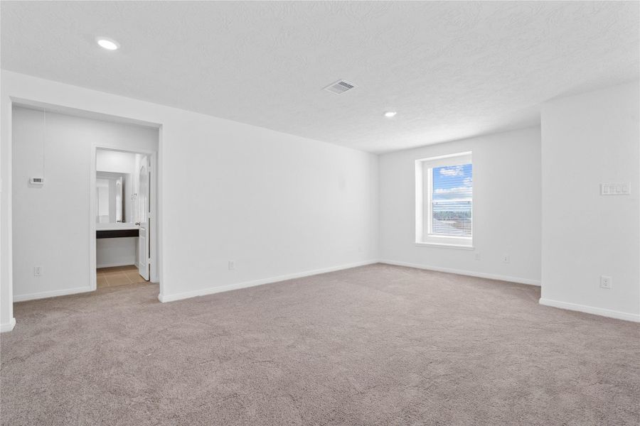 Come upstairs and enjoy a day of leisure in this fabulous and spacious Game Room! This is the perfect hangout spot or adult game room, this space features plush carpet, high ceiling, recessed lighting, custom paint and plenty of windows that will add natural light! Come upstairs and enjoy a day of leisure in this fabulous and spacious Game Room! This is the perfect hangout spot or adult game room, this space features plush carpet, high ceiling, recessed lighting, custom paint and plenty of windows that will add natural light!