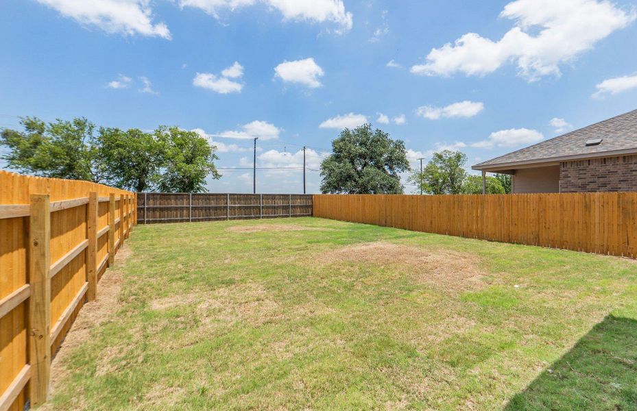 Exterior details and patio area of a home in Crosswinds, Kyle (Image 16).