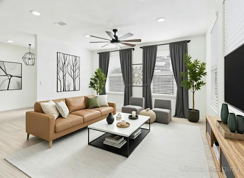 Living area featuring ceiling fan and recessed lighting Living area featuring ceiling fan and recessed lighting