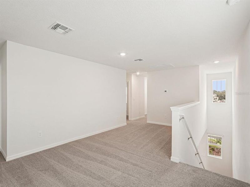 Spacious, unfurnished interior of a new home in Coasterra - Premier Series, Palmetto (Image 27).