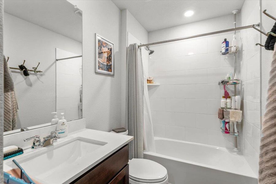 Full bath with vanity and shower / bathtub combination with curtain