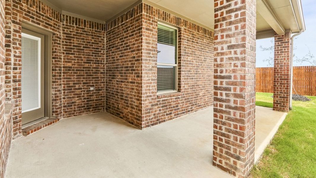 Exterior details and patio area of a home in The Woods at Lindsey Place, Anna (Image 3).
