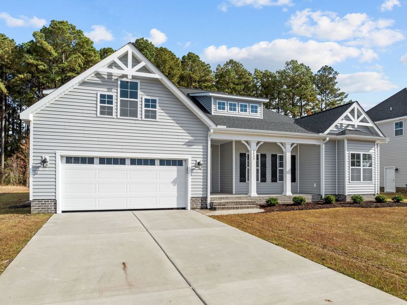 Front exterior of a new home in The Preserve at Langston, Winterville, NC, highlighting curb appeal (Image 23). Front exterior of a new home in The Preserve at Langston, Winterville, NC, highlighting curb appeal (Image 23).