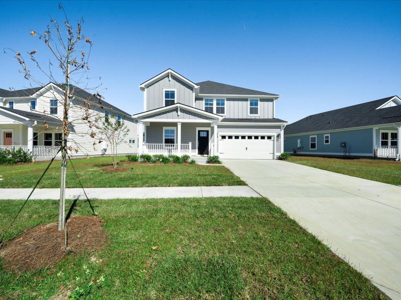Front exterior of a new home in The Coves at Lakes of Cane Bay, Summerville, SC, highlighting curb appeal (Image 19).