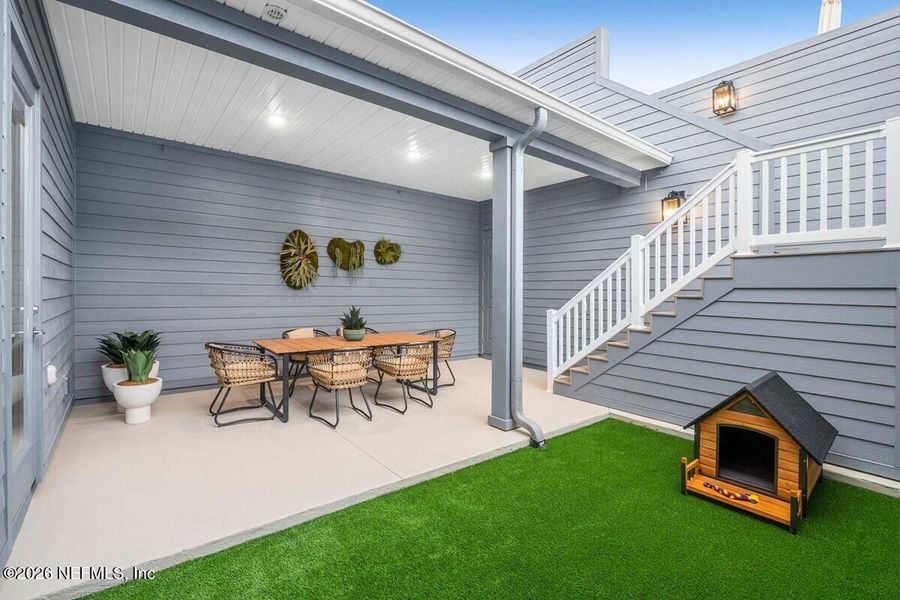 Exterior details and patio area of a home in Seven Pines 24' Rear Entry Townhomes, Jacksonville (Image 8). Exterior details and patio area of a home in Seven Pines 24' Rear Entry Townhomes, Jacksonville (Image 8).