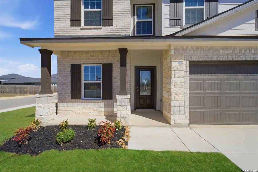 Exterior details and patio area of a home in Hickory Ridge, Elmendorf (Image 3).