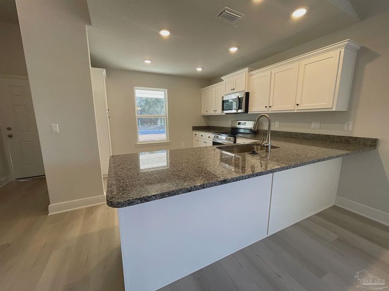 Furnished interior view inside a new home in Turtle Creek, Cantonment (Image 6).