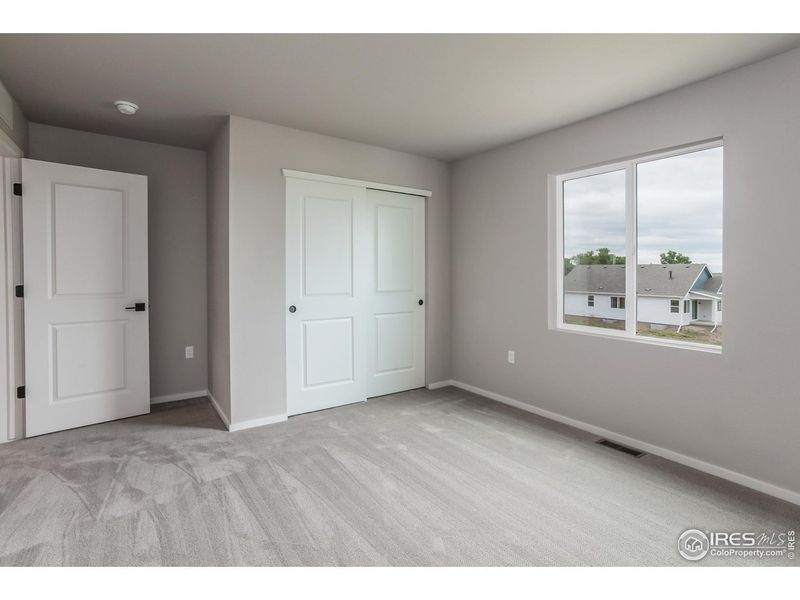 Spacious, unfurnished interior of a new home in Granary Trailblazer Collection - Single Family Homes, Johnstown (Image 19).