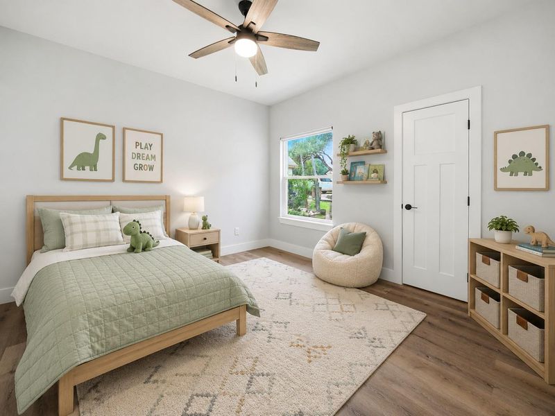 A well-lit bedroom featuring a light wood flooring and a modern ceiling fan for comfort. A well-lit bedroom featuring a light wood flooring and a modern ceiling fan for comfort.