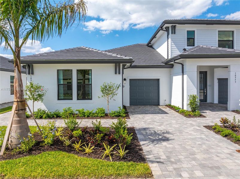 Front exterior of a new home in , Fort Myers, FL, highlighting curb appeal (Image 17). Front exterior of a new home in , Fort Myers, FL, highlighting curb appeal (Image 17).