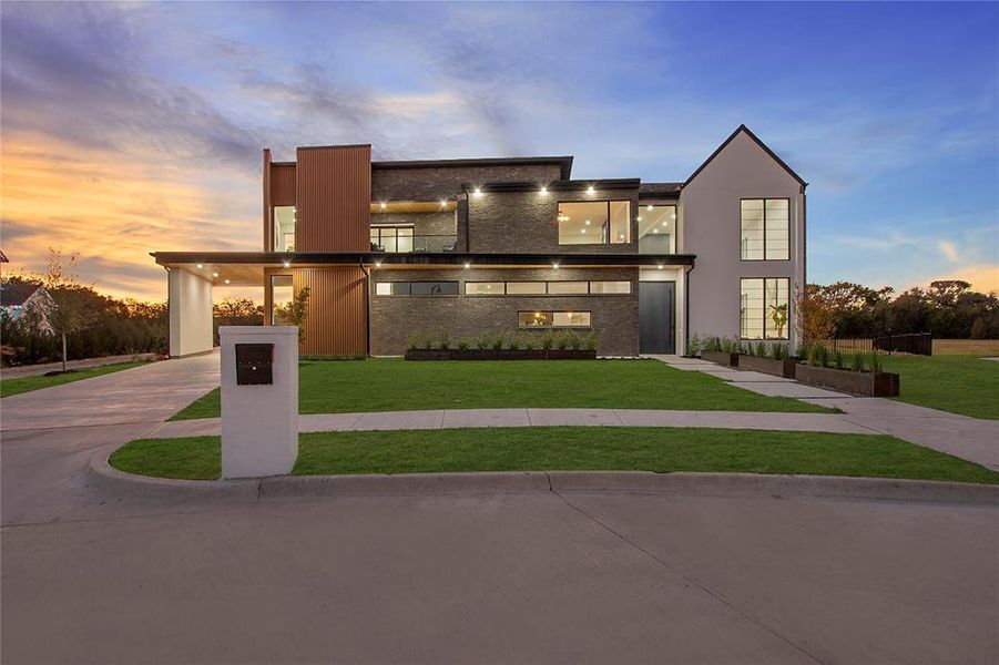 Contemporary home featuring a lawn