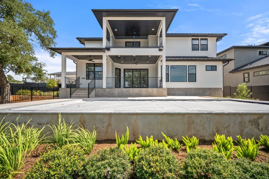 Front exterior of a new home in Milky Way at River Place, Austin, TX, highlighting curb appeal (Image 16). Front exterior of a new home in Milky Way at River Place, Austin, TX, highlighting curb appeal (Image 16).