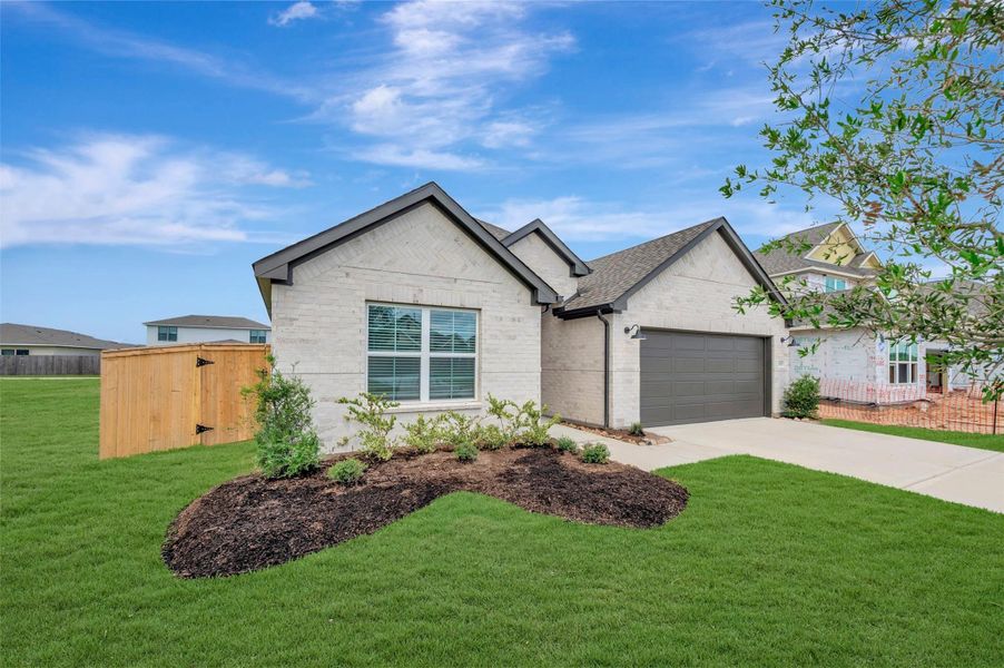 Front exterior of a new home in Hallimore Ranch, Rosenberg, TX, highlighting curb appeal (Image 19). Front exterior of a new home in Hallimore Ranch, Rosenberg, TX, highlighting curb appeal (Image 19).