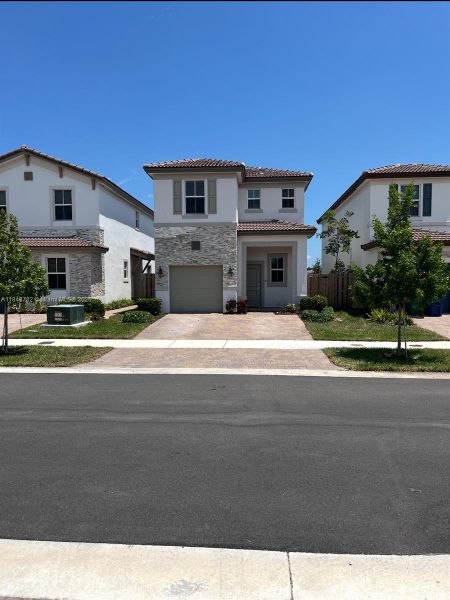 Front exterior of a new home in , Miami, FL, highlighting curb appeal (Image 1). Front exterior of a new home in , Miami, FL, highlighting curb appeal (Image 1).