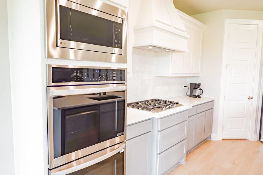 Representative furnished interior of a home built from the The Lilac by Lillian Custom Homes in Polo Ridge, Heath (Image 23).