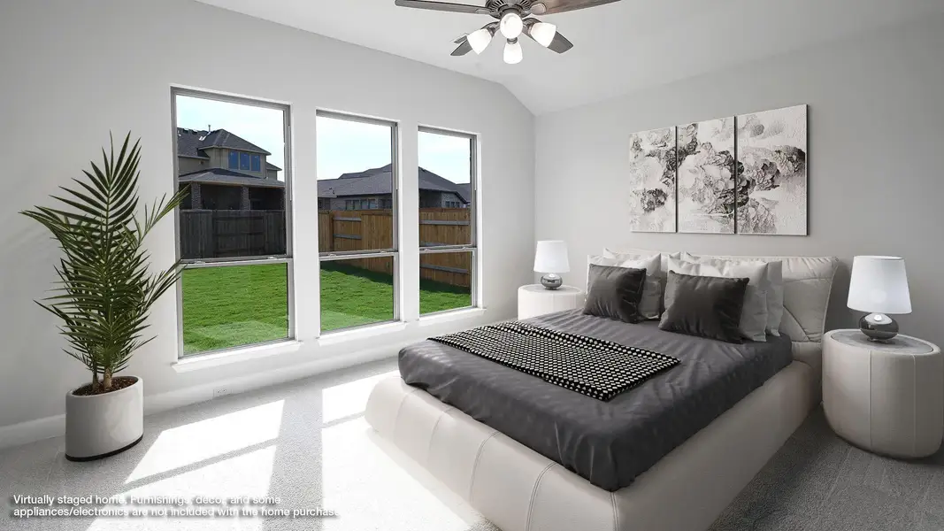 Bedroom featuring lofted ceiling and ceiling fan