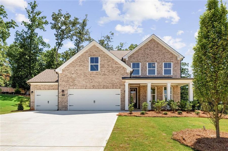 Front exterior of a new home in Melody Lakeside Estates, Buford, GA, highlighting curb appeal (Image 1). Front exterior of a new home in Melody Lakeside Estates, Buford, GA, highlighting curb appeal (Image 1).