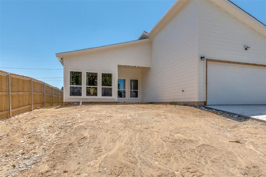 Rear view of house featuring a garage