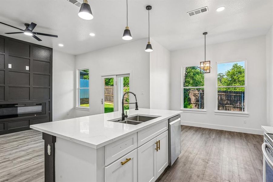 Kitchen island with a white countertop and integrated dual-basin sink